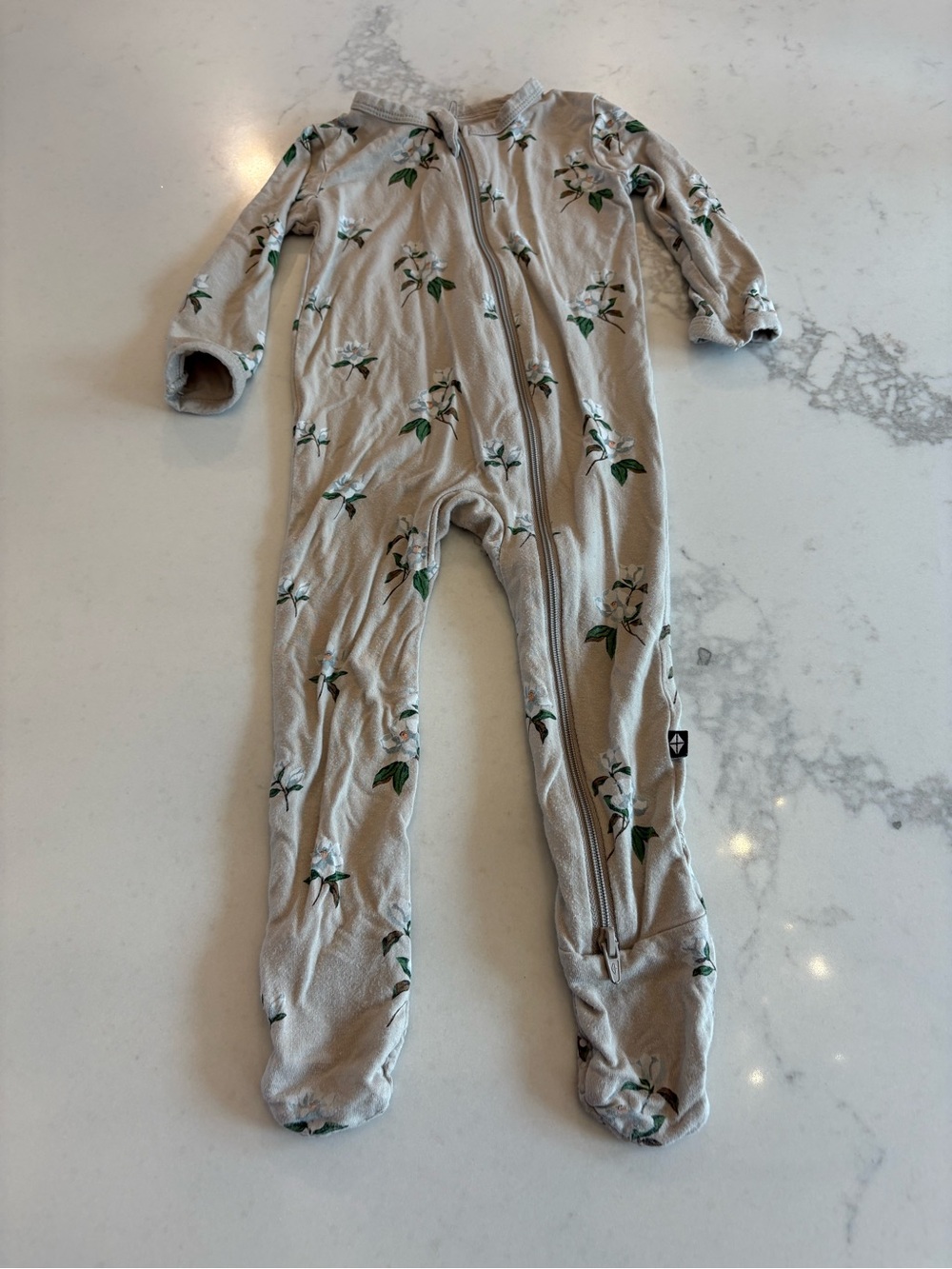 Kyte BABY Neutral Floral Footed One-Piece Pajamas in Beige and Green